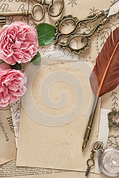 Old letters antique feather pen pink rose flowers Paper background