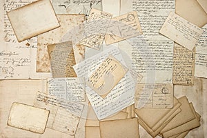 Old letters, handwritings, vintage postcards. Grungy paper texture