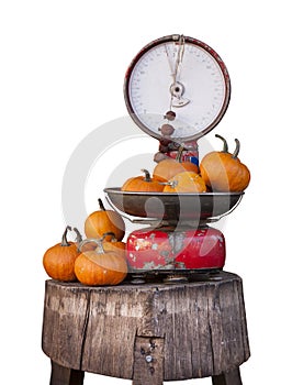 Old libra balance and pumpkins. Isolated on white.