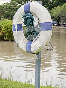 Old lifebuoy for a lifeguard to save people from dro photo