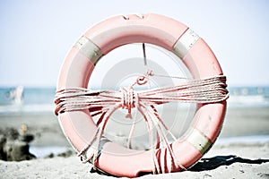 An old lifebuoy , lifeguards from times gone by