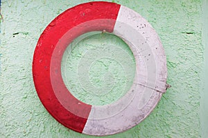 Old lifebuoy on a wall