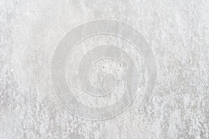 Old light gray wall close-up, peeling plaster. Cracks on surface. Vintage background
