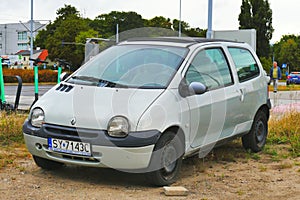 Old light grey Renault Twingo private compact car parked