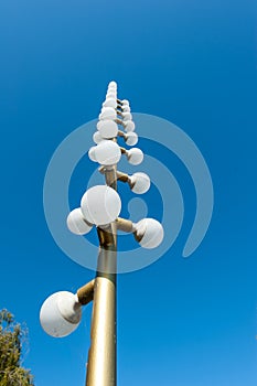 Old light pole with many lightbulbs on it