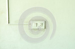 Old light switch on the green wall