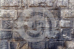 Old Light yellow stone wall of bricks texture background