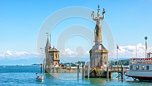 Old lighthouse and big statue of Imperia in harbor of Konstanz, Germany