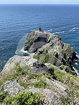 Old lighthouse on Cape Elagina on Askold Island in summer. Russia, Primorsky Krai