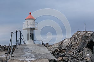 Old lighthouse in Laukvik in gray weather, Lofoten, Nordland, Norway