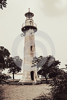 old lighthouse near river and sea