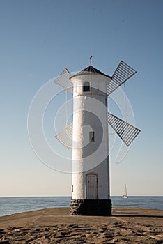 Old lighthouse in Swinoujscie, a port in Poland on the Baltic Sea. The lighthouse was designed as a traditional windmill.