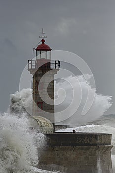 Old lighthouse under heavy storm