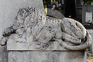 Old lion statue in the Lychakiv cemetery of Lviv, Ukraine