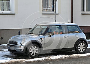 Old classic veteran small compact car Mini Cooper second generation parked