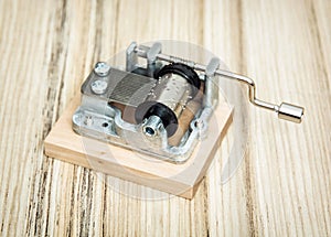 Old little music box on the wooden background