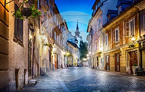 Old Ljubljana cityscape cobbled street evening view. Ljubljana c