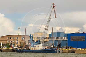 Old loading ship with jib crane near the Klaipeda.