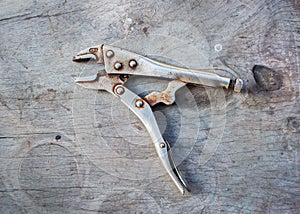 Old Lock Grip Pliers on wood