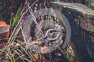 Old lock and rusty chain on a wooden boat