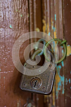 Old lock on the wooden gate