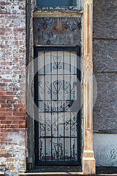 Old locked door with ornate iron bars