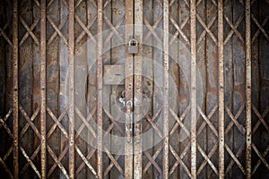 Old Locked Foldable Rusted Steel Door