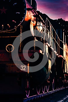 Old locomotive in the background of the sunset