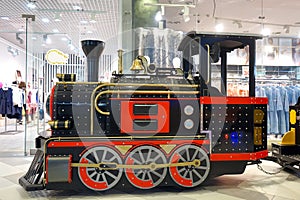 An old locomotive for children riding in the shopping center