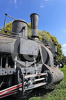 Old locomotive next to the railway station