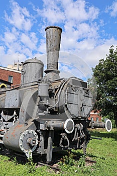 Old locomotive next to the railway station