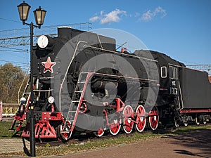 Old locomotive at station platform