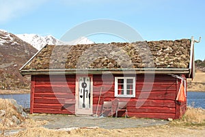 Old Lofoten's rorbu with grass on the roof