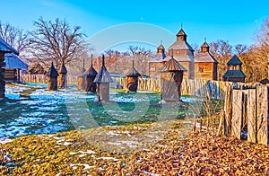 The old log hives and the Resurrection Church, Polissya Region architecture, Pyrohiv Skansen, Kyiv, Ukraine