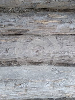 Old logs background, wall of wooden Brown logs