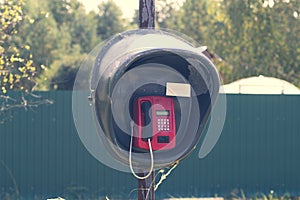 Old lonely payphone in an abandoned village