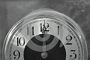 Old long and short clockwises pointing on twelve o` clock at noon or midnight background