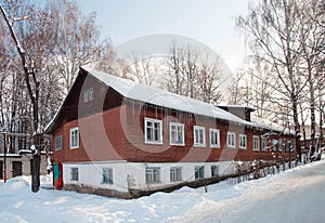 Old long wooden house, winter time