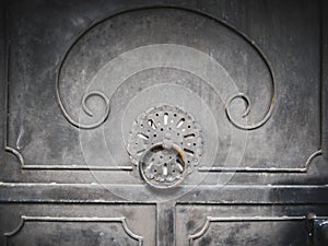 Old looking door with knock and oriental ornaments with retro style design as an old entrance to a historical building