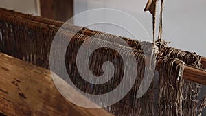 Old loom. Device for the manufacture of textile products, close-up.