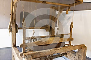 Old loom. Device for the manufacture of textile products, close-up, traditional