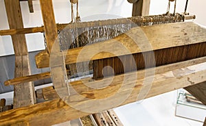 Old loom. Device for the manufacture of textile products, close-up, traditional