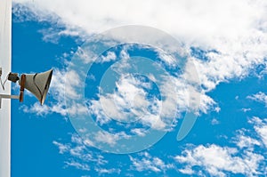 Old loudspeaker and sky