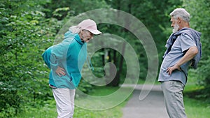 Old love couple sport exercise. Elderly fun people training workout forest park.