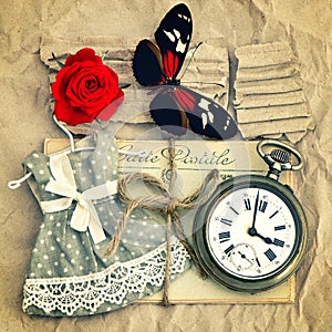 Old love mails, vintage pocket watch, red rose flower and butter