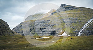 The old Lutheran church in Saksun village with view over the saksun falley on the island of Streymoy, Faroe Islands