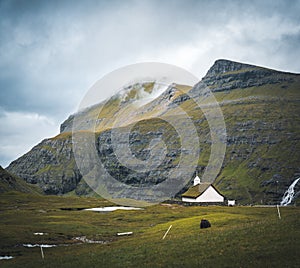 The old Lutheran church in Saksun village with view over the saksun falley on the island of Streymoy, Faroe Islands