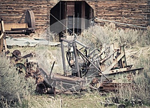 Old Machinery by an Abandoned Grain Elevator