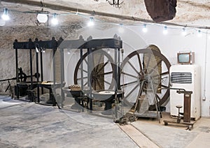 Old machinery for olive oil manufacture at Masseria Il Frantoio, Southern Italy