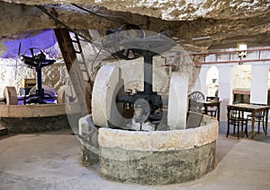 Old machinery for olive oil manufacture at Masseria Il Frantoio, Southern Italy